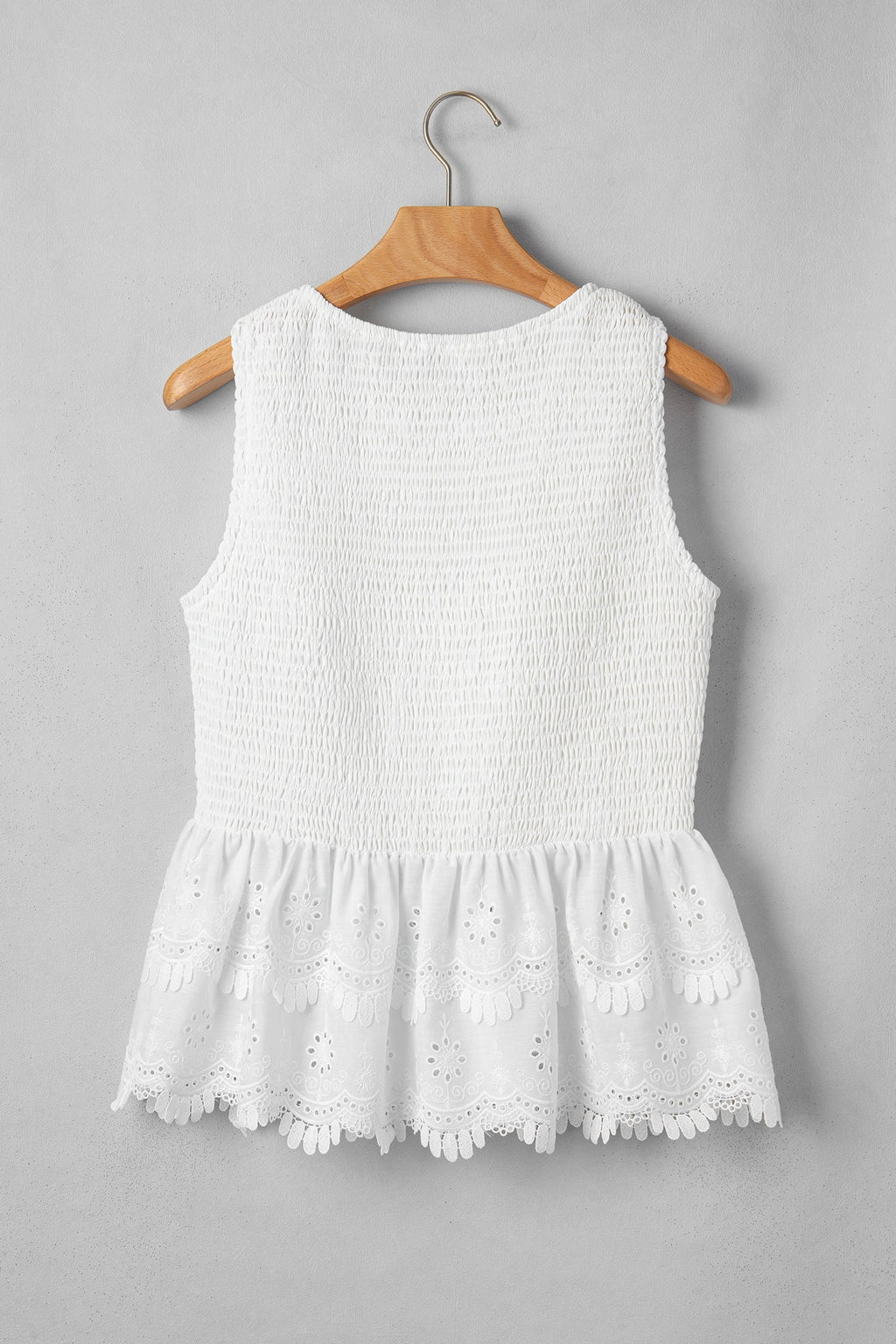 White peplum top smocked bodice detail