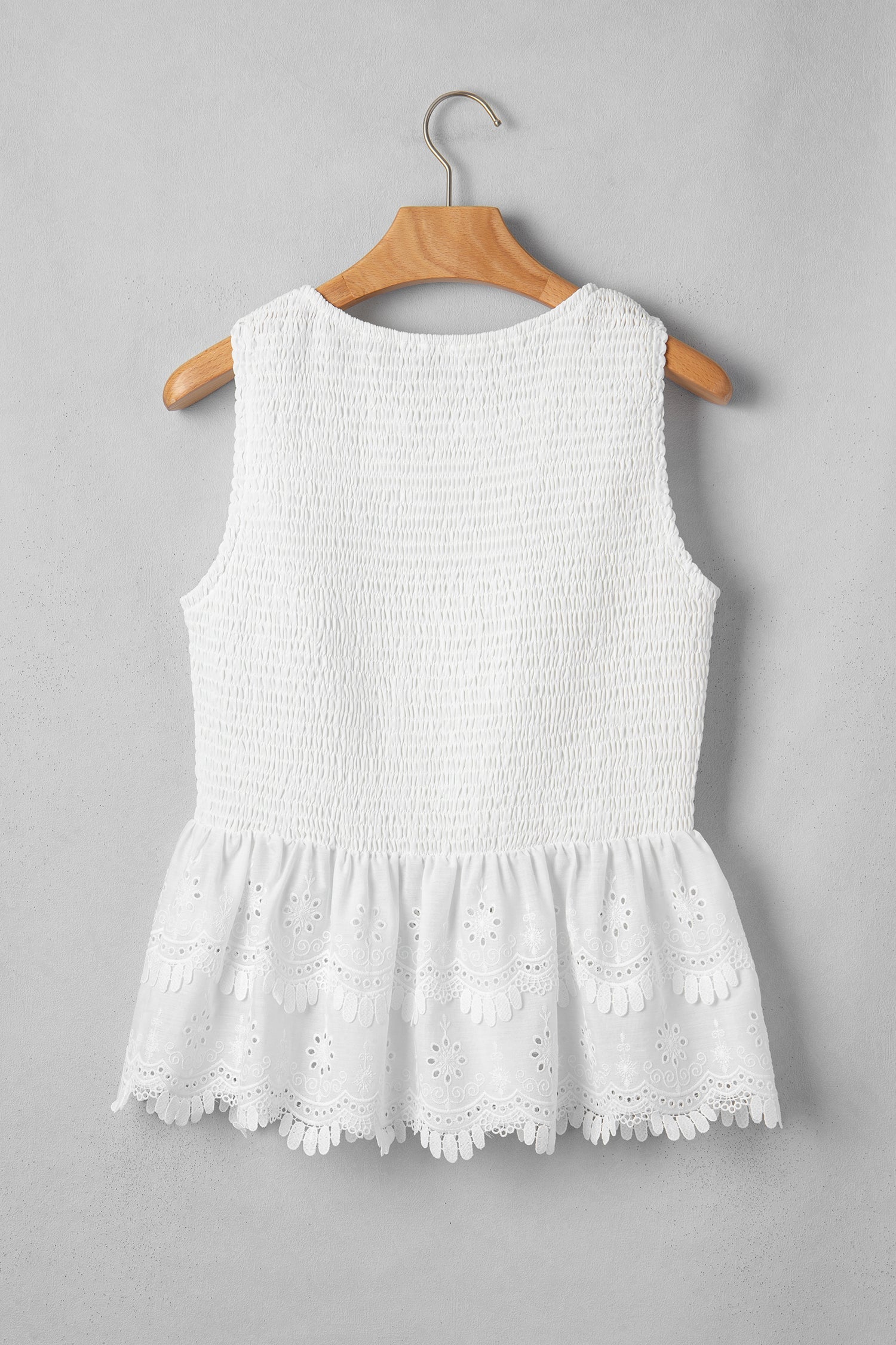 White peplum top smocked bodice detail