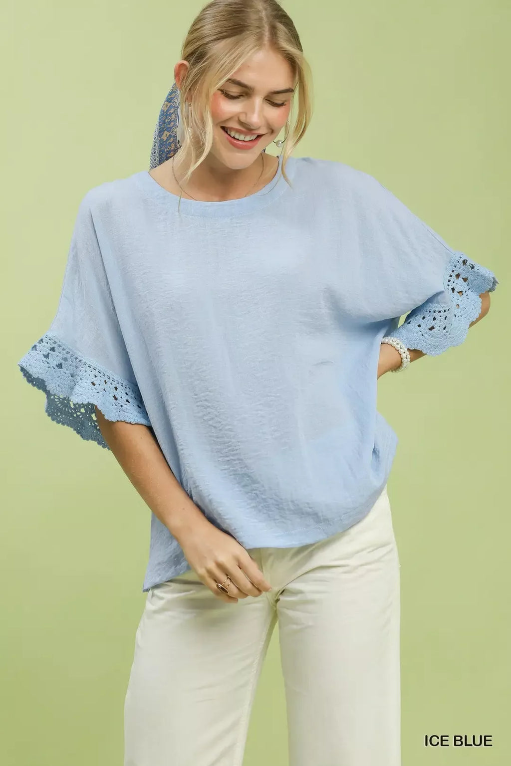 Umgee Crochet Trim Flutter Sleeve Top in Ice Blue - front view showing flutter sleeves and crochet trim