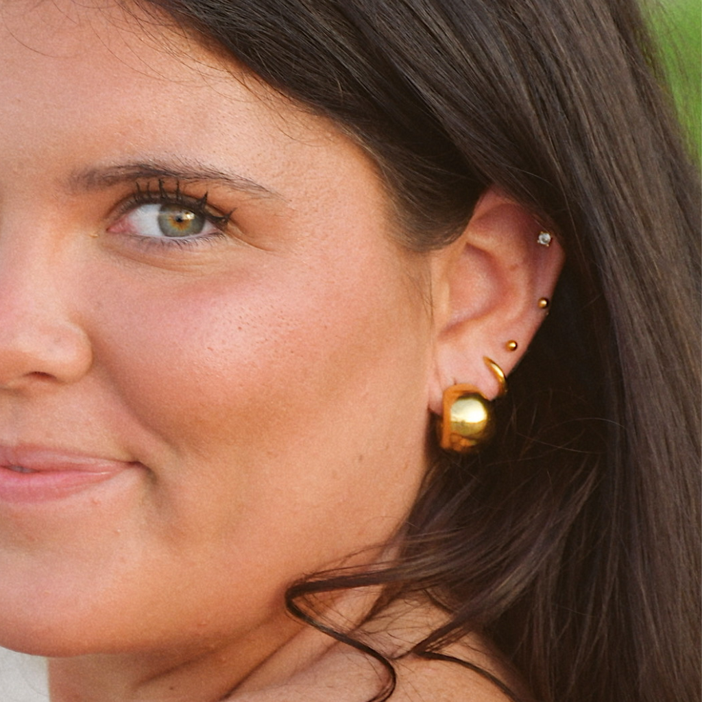 The Icon Hoops - close up showing bold gold finish