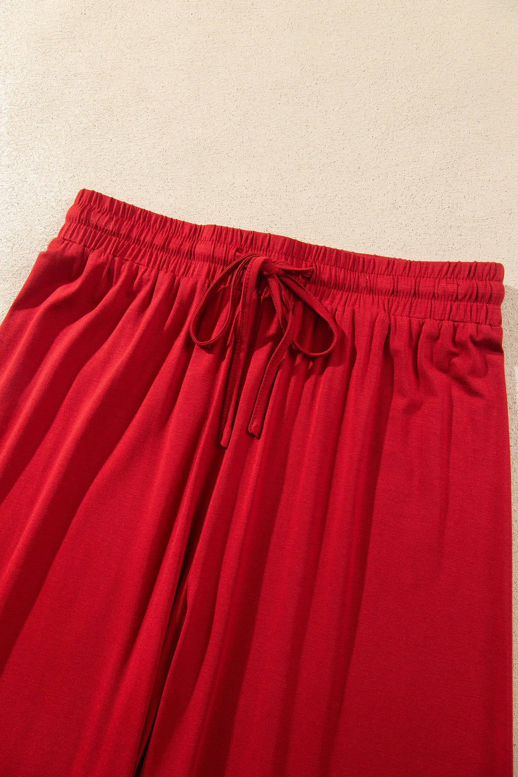 Bow Embroidered Pajama Set in racing red, piping trim close-up