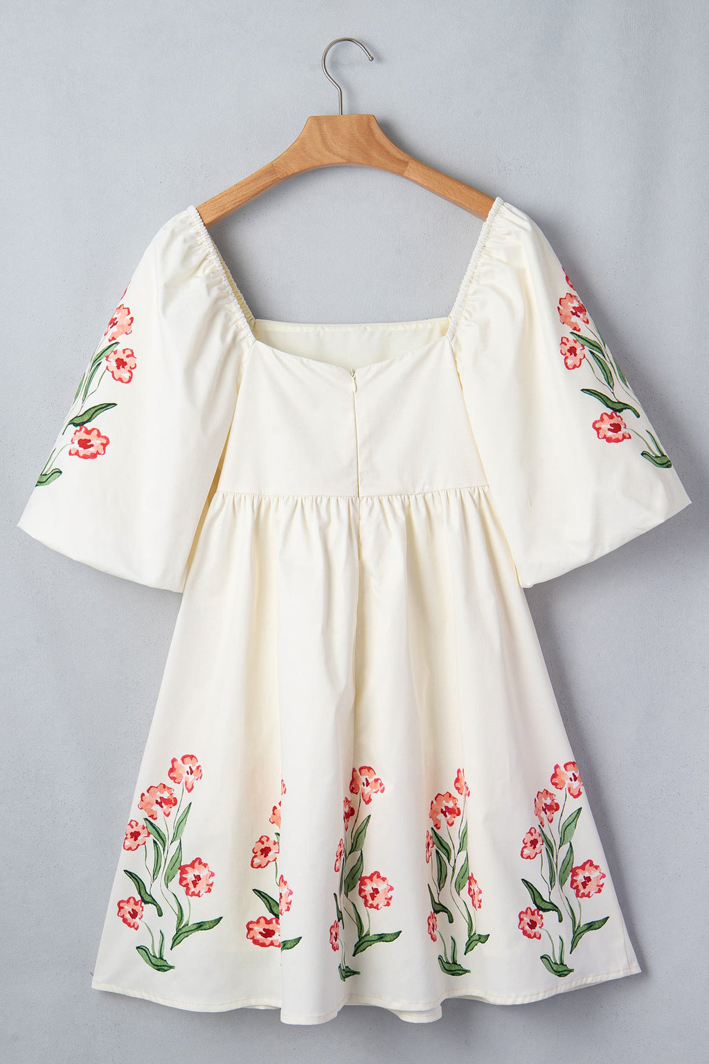 Floral Puff Sleeve Babydoll Dress in Beige with floral print, square neckline, puff short sleeves, and high waist silhouette shown on model