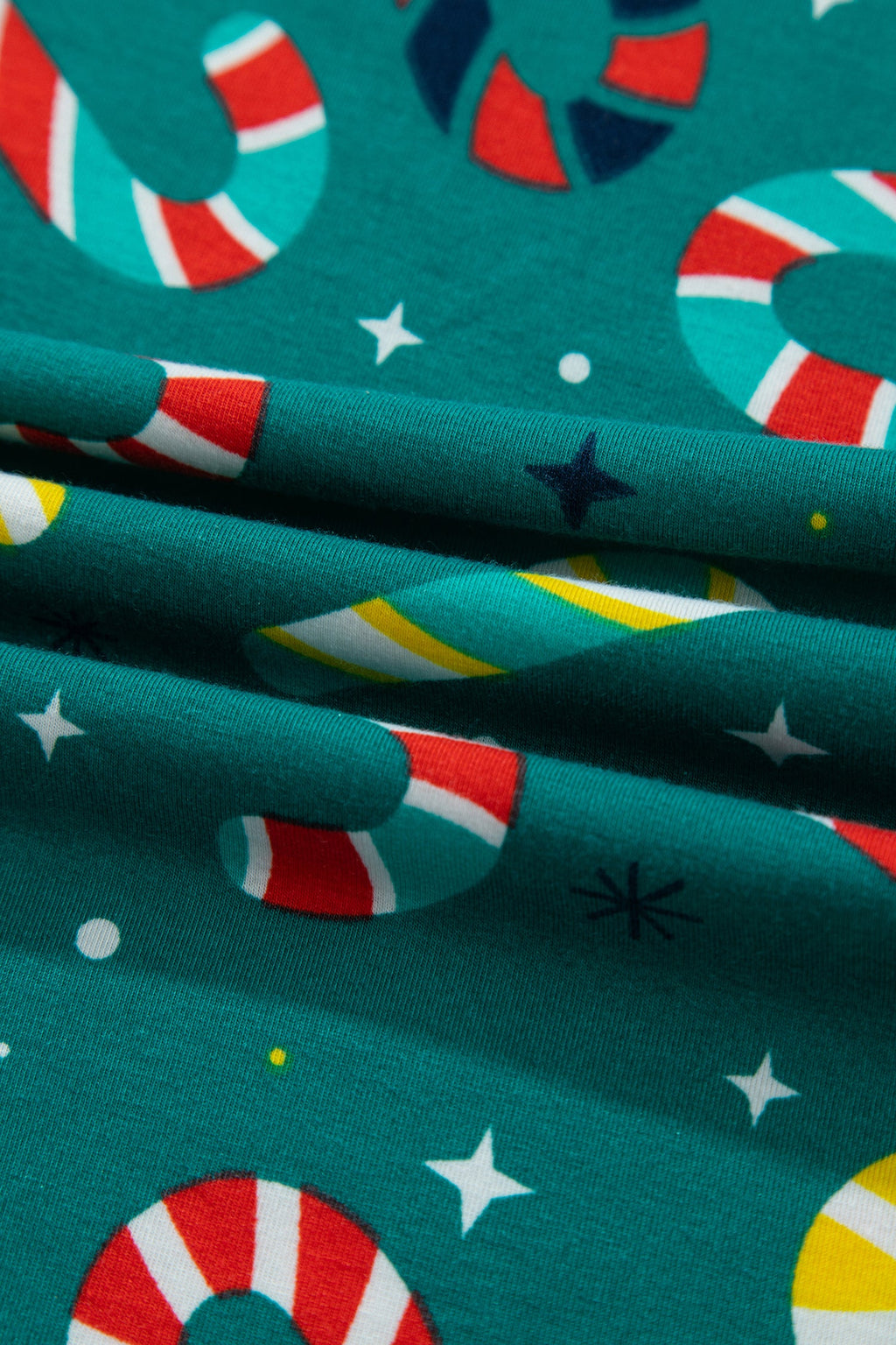 Christmas Candy Cane Pajama Set in green, lifestyle view
