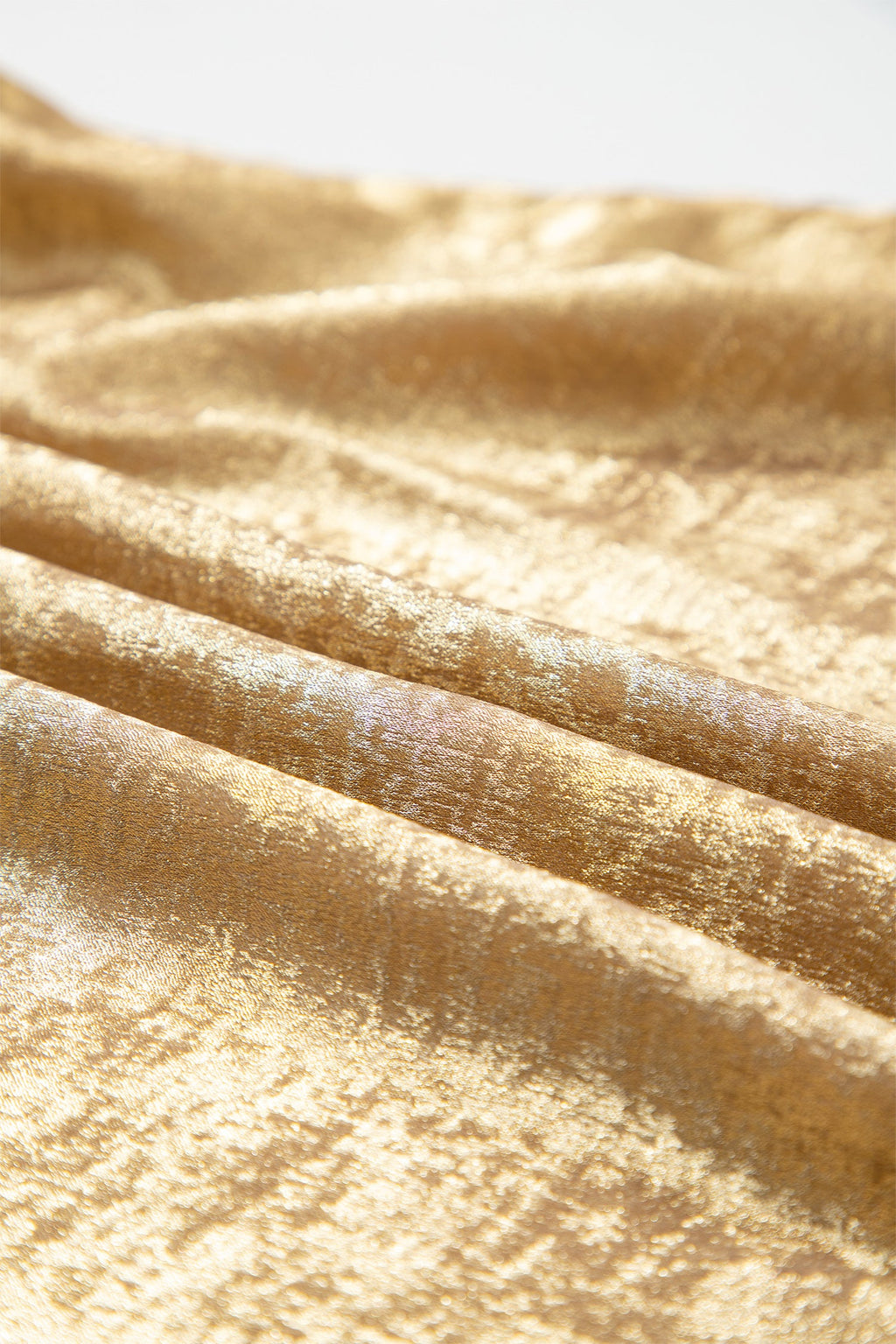 Gold metallic blouse sleeve detail