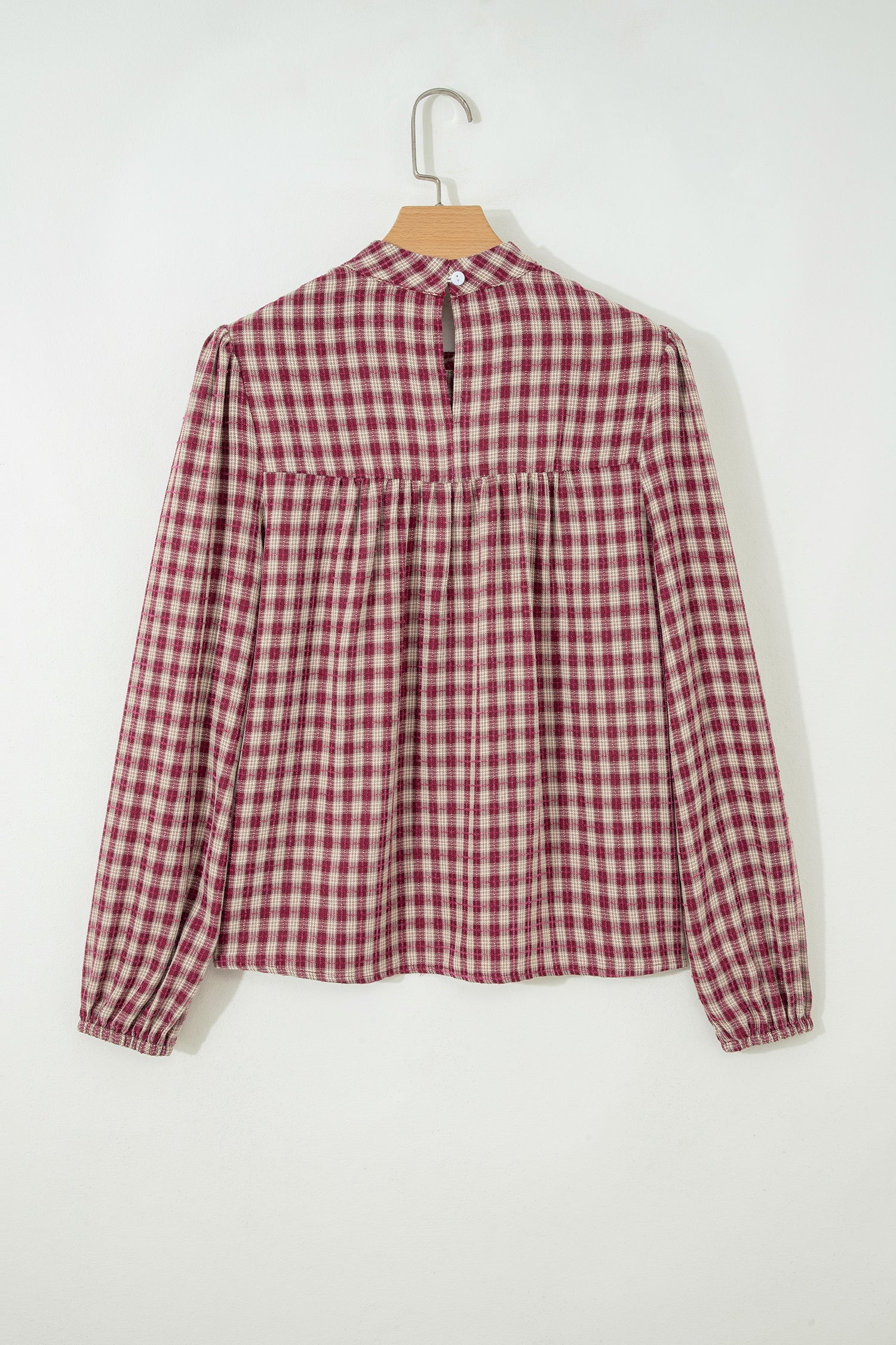 Plaid blouse keyhole button detail