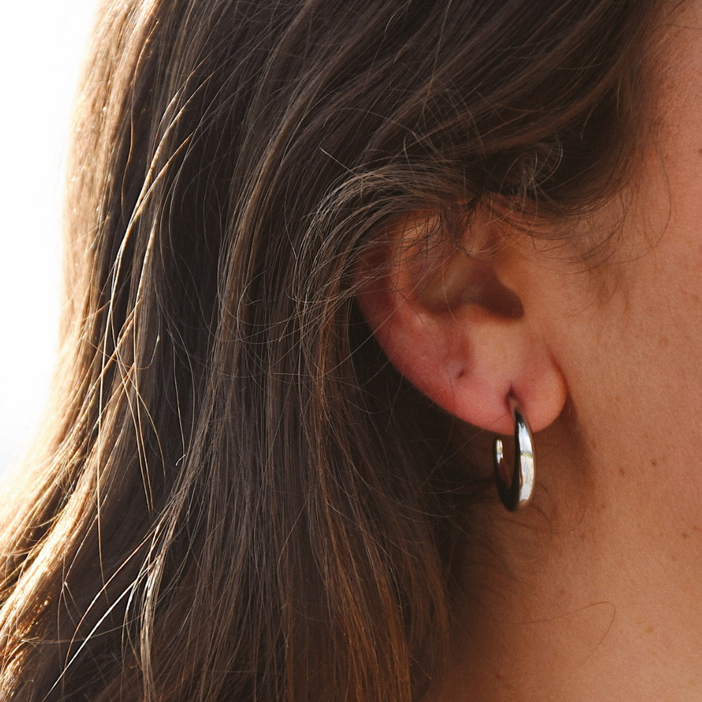 Silhouette Silver Hoops - flat lay view
