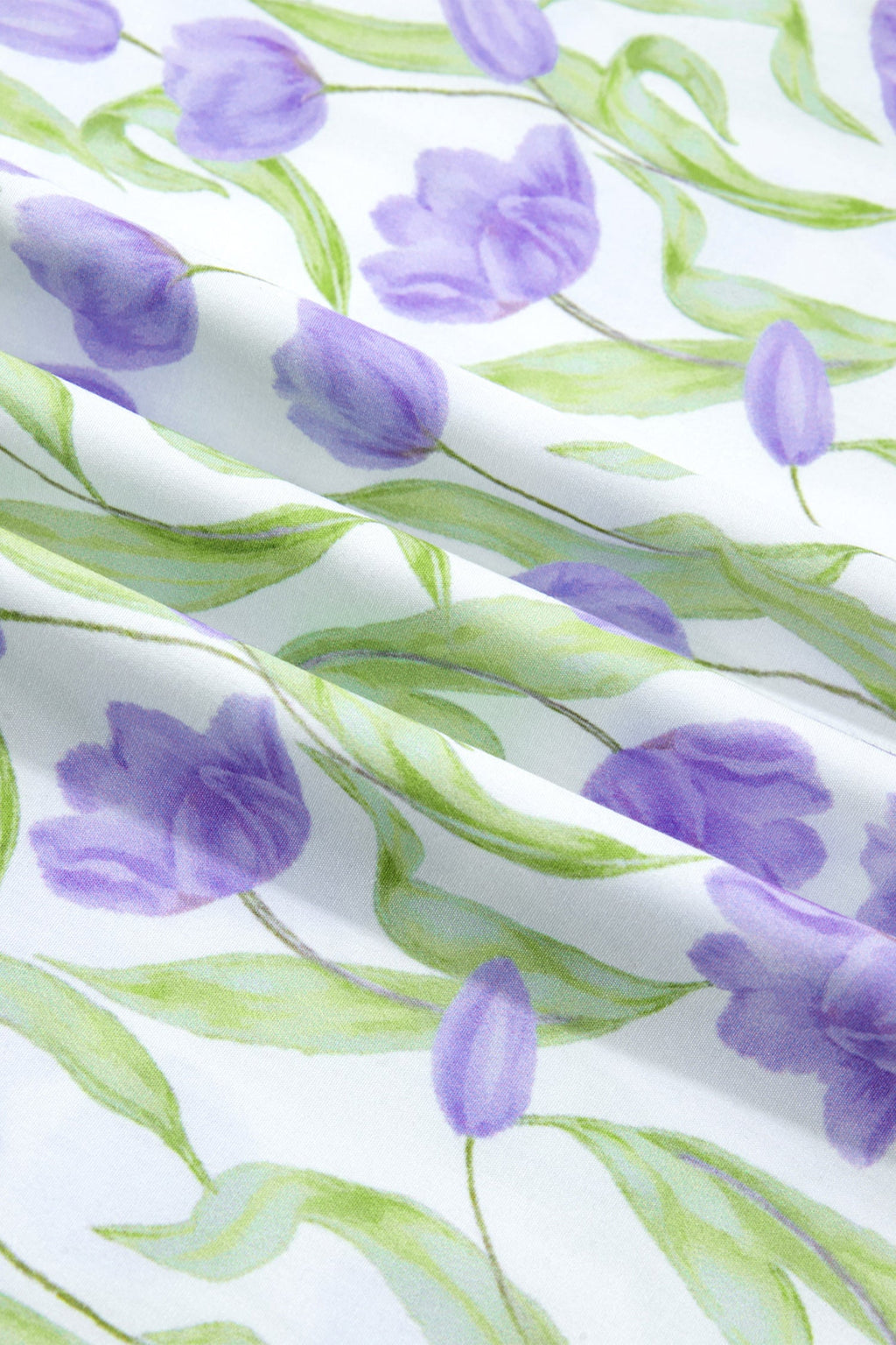 Floral Tulip Contrast Trim Midi Dress in Purple with floral print, colorblock contrast trim, flutter sleeves, and relaxed shift silhouette shown on model