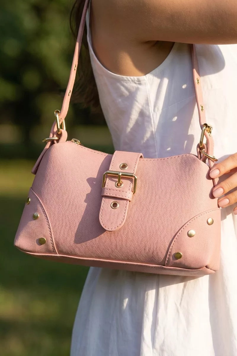 Fame Studded Saffiano Buckle Strap Shoulder Bag in Mauve - front view showing stud embellishments