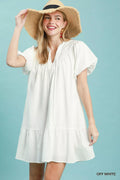 Umgee Flutter Sleeve Tassel Tie Ruffle Hem Mini Dress in Off White - front view showing tassel tie neckline