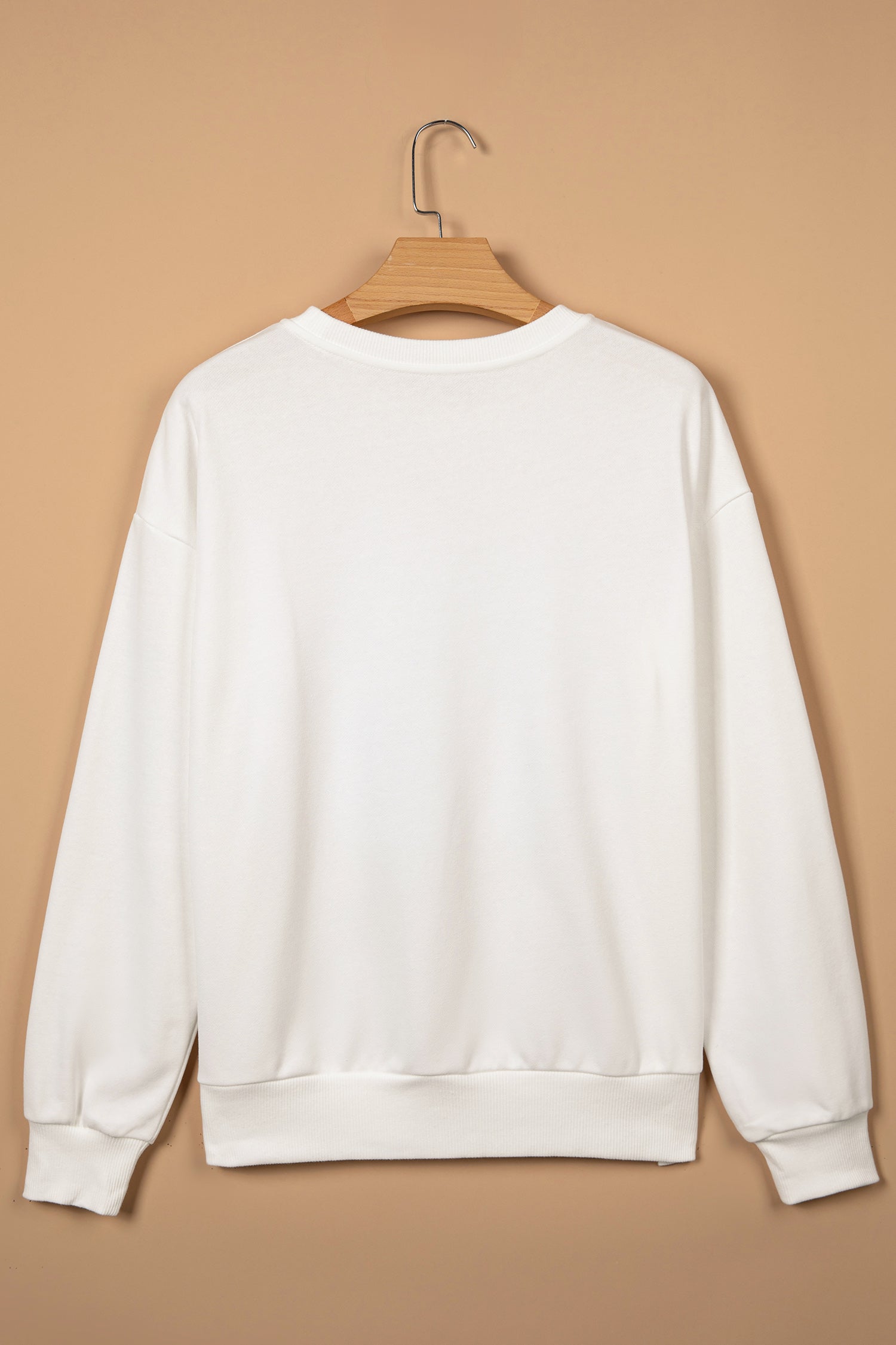 Christmas Holly Jolly Patchwork Sweatshirt in white, worn