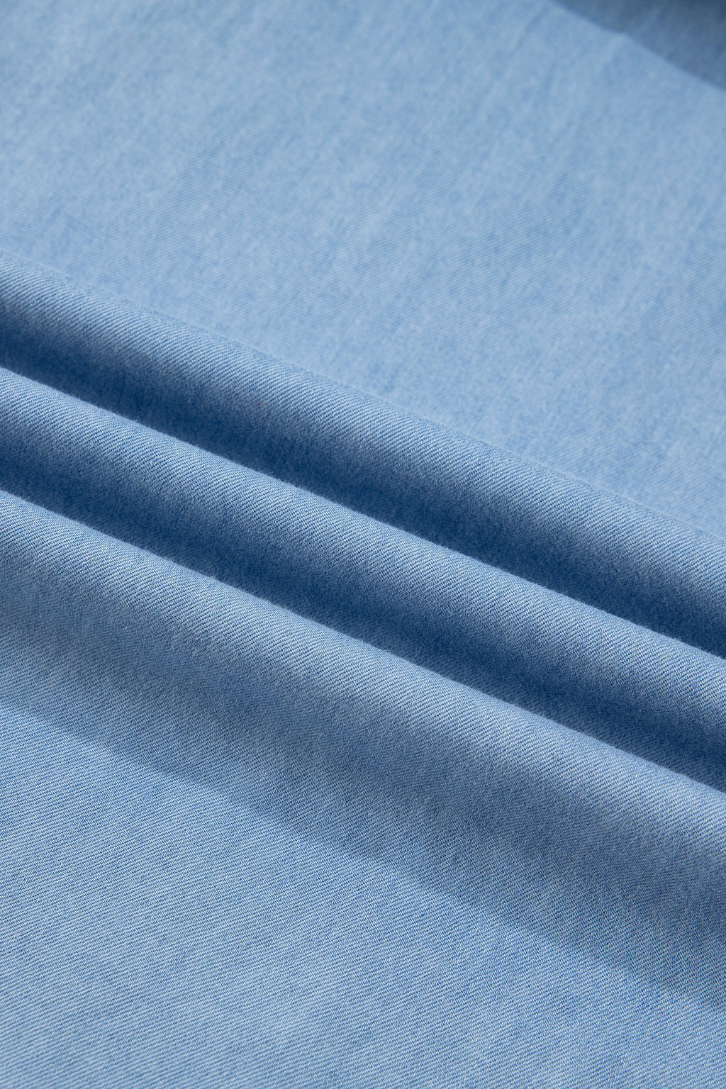 Chambray Ruffle V-Neck Blouse in beau blue, worn