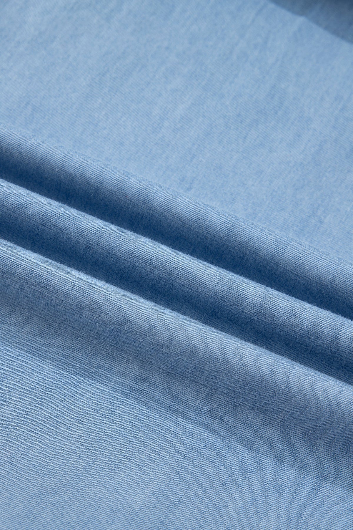 Chambray Ruffle V-Neck Blouse in beau blue, worn