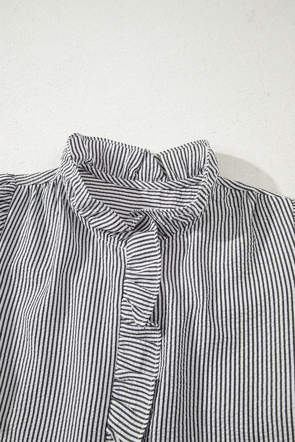 Black striped bubble sleeve shirt styled look