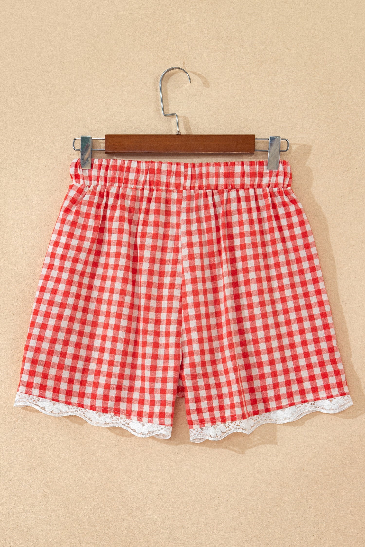 Gingham Plaid Tie Waist Lace Hem Shorts in Red with gingham print, front tie waist, and lace hem trim shown on model