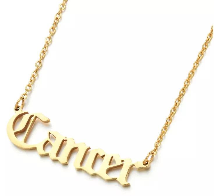 Old English Zodiac Necklace - multiple zodiac signs flat lay