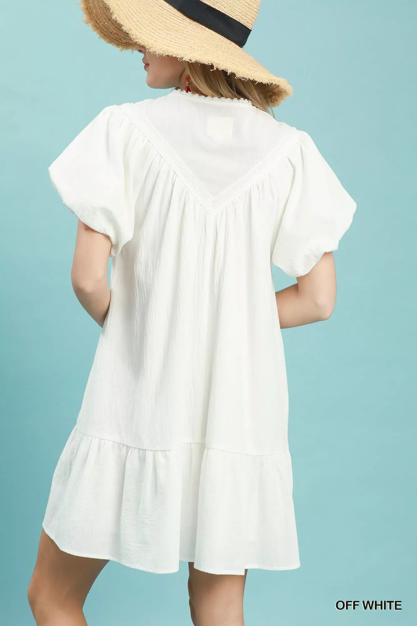 Umgee Flutter Sleeve Tassel Tie Ruffle Hem Mini Dress - close up of tassel tie and flutter sleeve detail