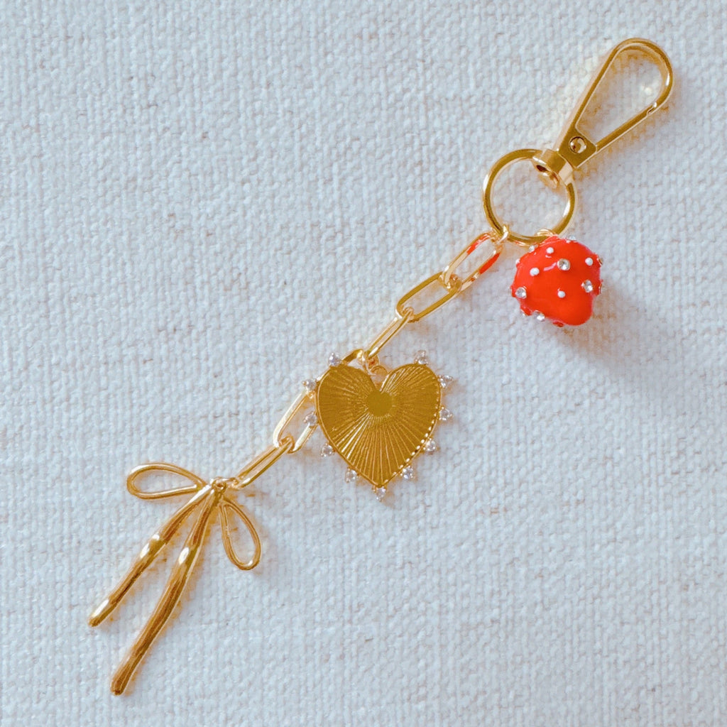All The Sweetness Bag Charm - clipped to handbag