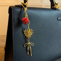 All The Sweetness Bag Charm - heart and bow charm in gold tone