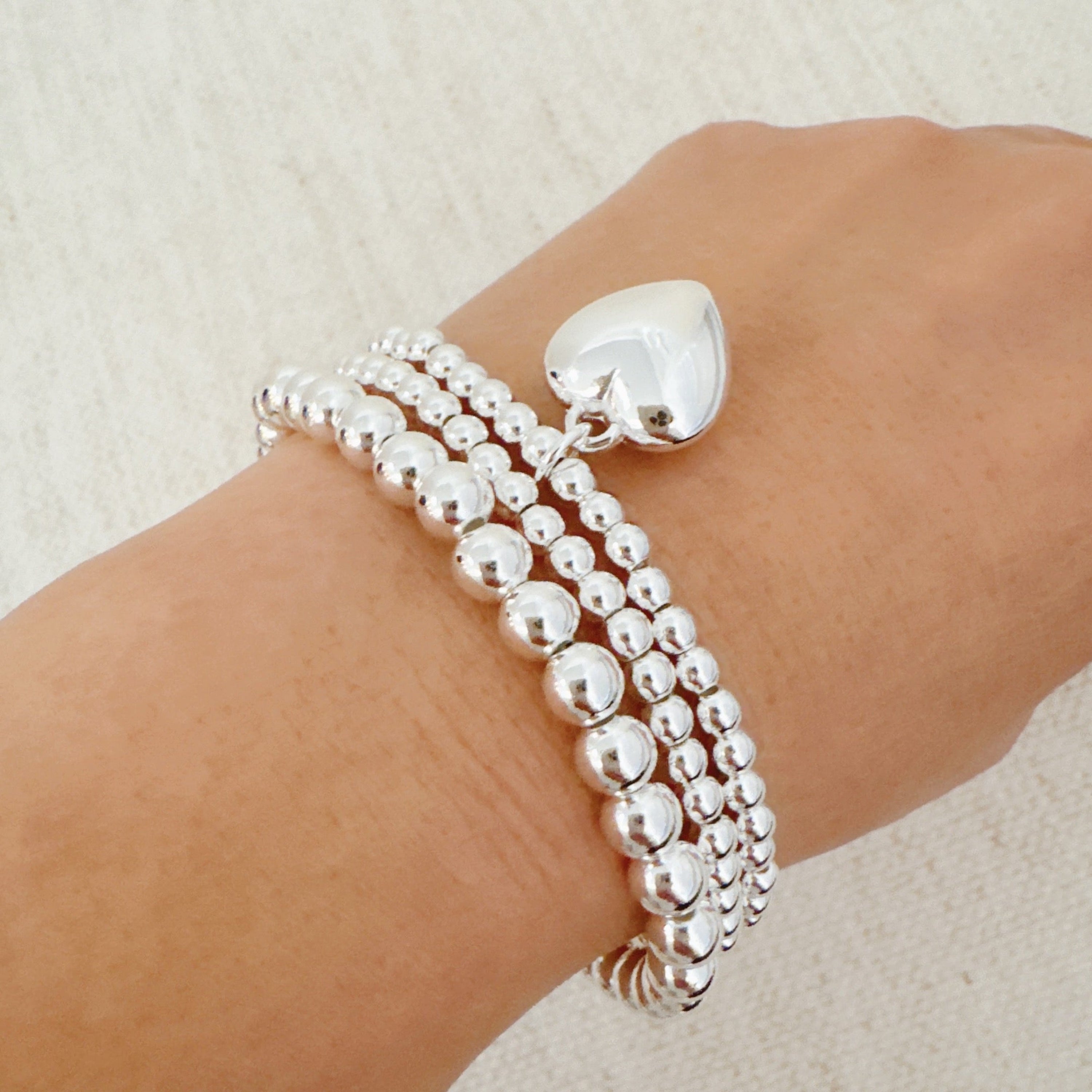 Ball Beads Golden Heart Stretch Bracelet Set Of 3 in Silver