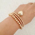 Ball Beads Golden Heart Stretch Bracelet Set Of 3 - styled on wrist