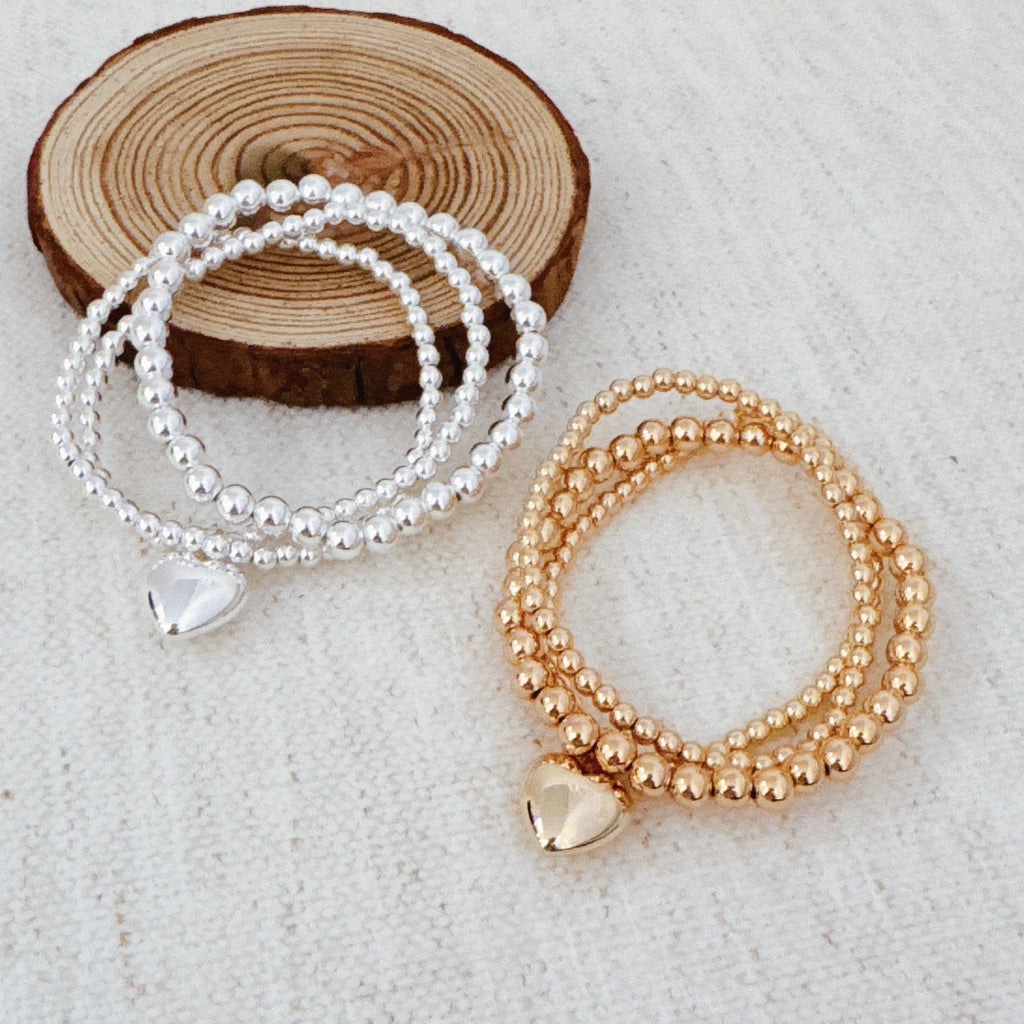 Ball Beads Golden Heart Stretch Bracelet Set Of 3 in Gold - ball bead bracelet with heart accent