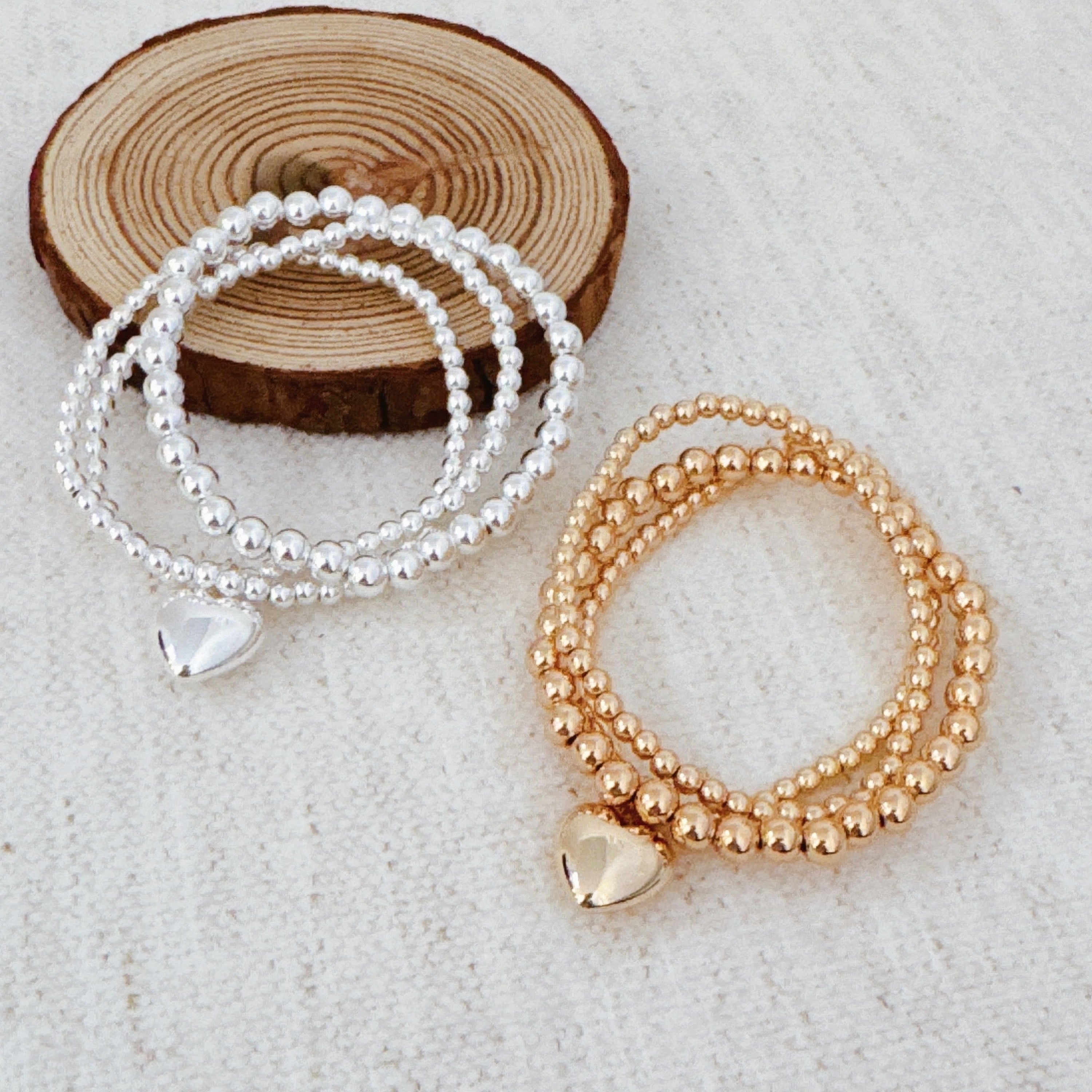 Ball Beads Golden Heart Stretch Bracelet Set Of 3 in Gold - ball bead bracelet with heart accent