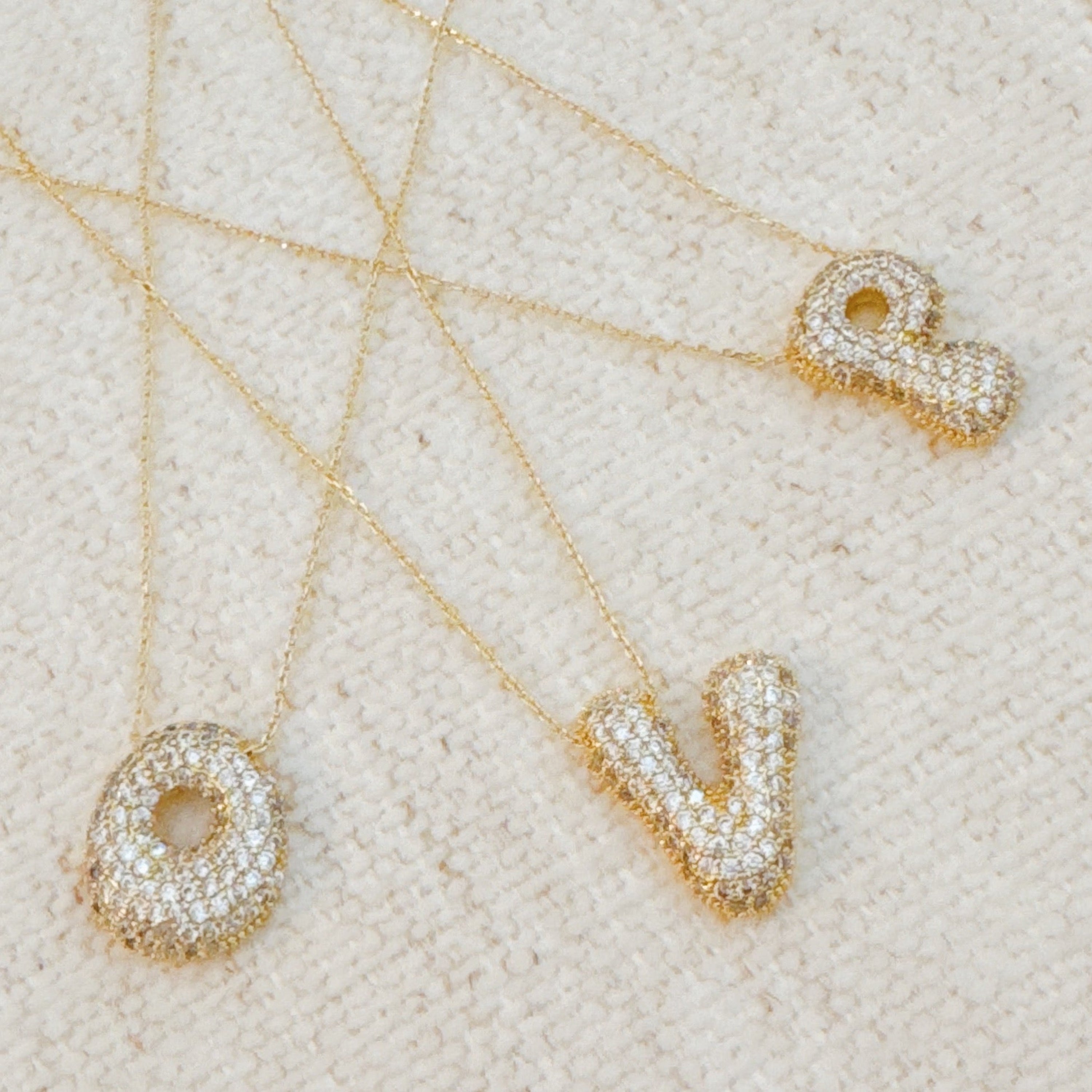 Crystal Bubble Initial Necklace - multiple letter options flat lay