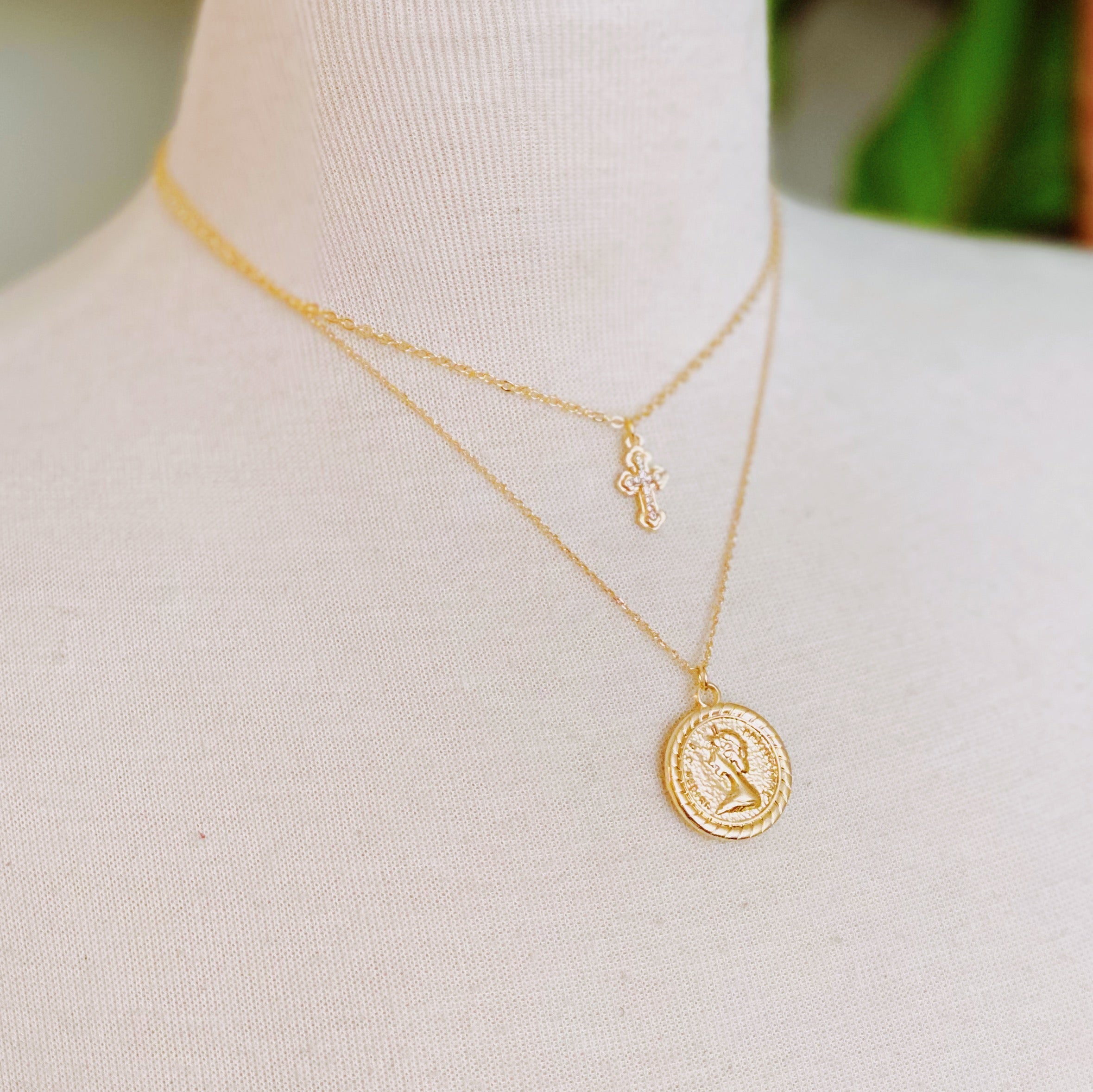 Cross And Coin Layered Necklace - styled on model