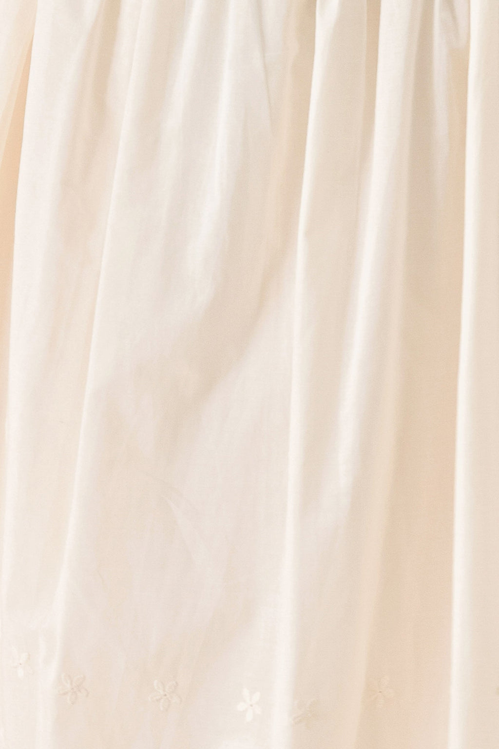 Daydream Thread Midi Dress in Light Taupe with sweater knit top, round neckline, sleeveless cut, drop waist, woven eyelet skirt, and cut out at waist shown on model