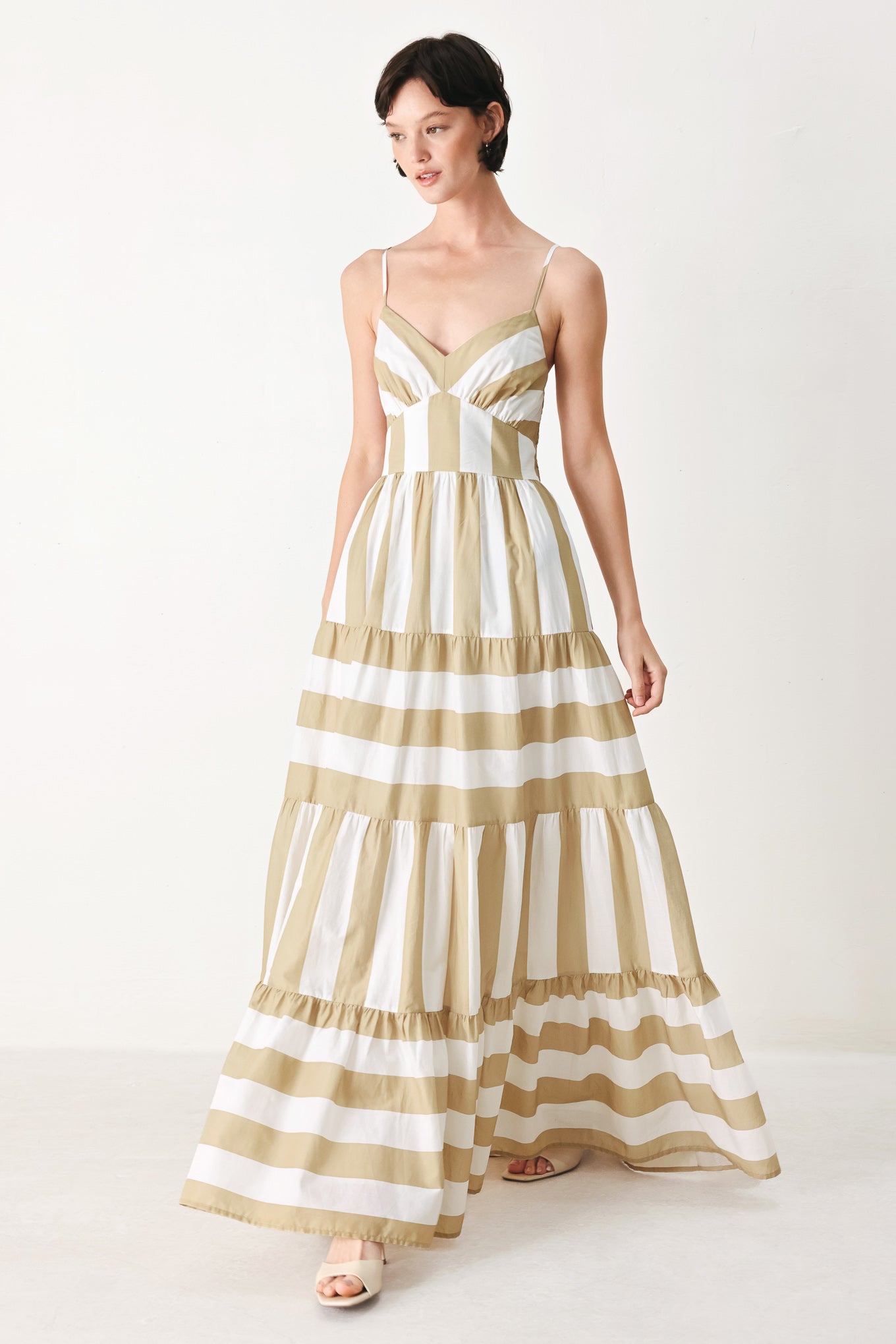 Sunkissed Boardwalk Woven Maxi Dress in Taupe White with stripe print, cami-style bodice, smocked back, and tiered skirt shown on model