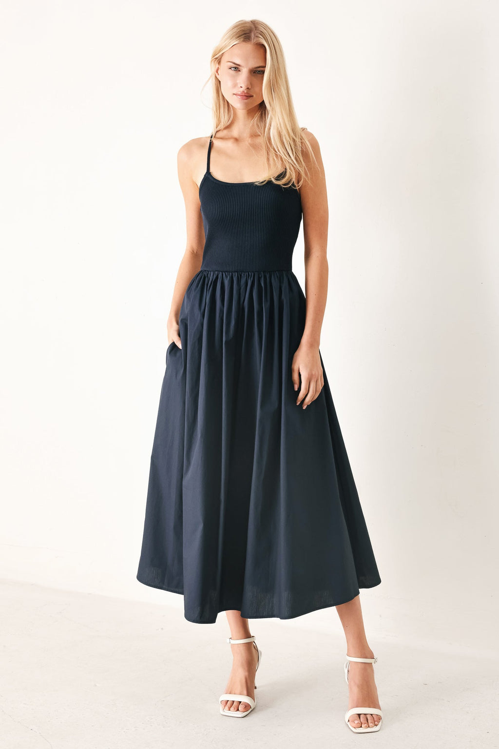 Easy Breeze Navy Woven Midi Dress with ribbed sweater knit tank top, solid woven skirt, bare back, and lace-up tie detail shown on model
