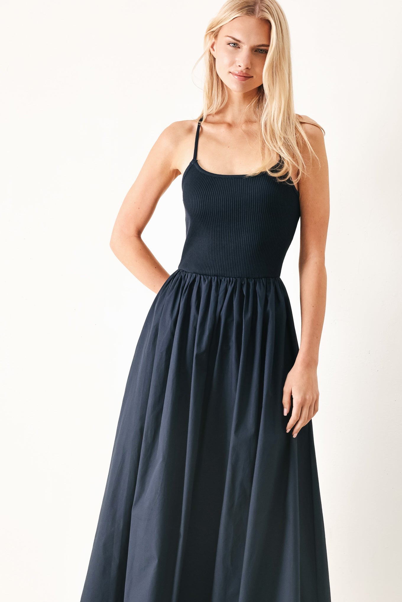 Easy Breeze Navy Woven Midi Dress with ribbed sweater knit tank top, solid woven skirt, bare back, and lace-up tie detail shown on model