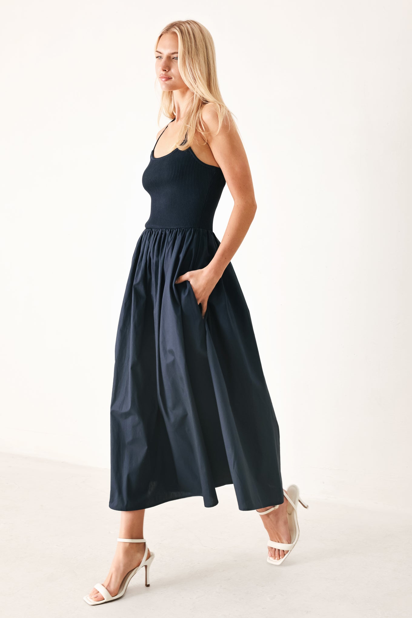 Easy Breeze Navy Woven Midi Dress with ribbed sweater knit tank top, solid woven skirt, bare back, and lace-up tie detail shown on model