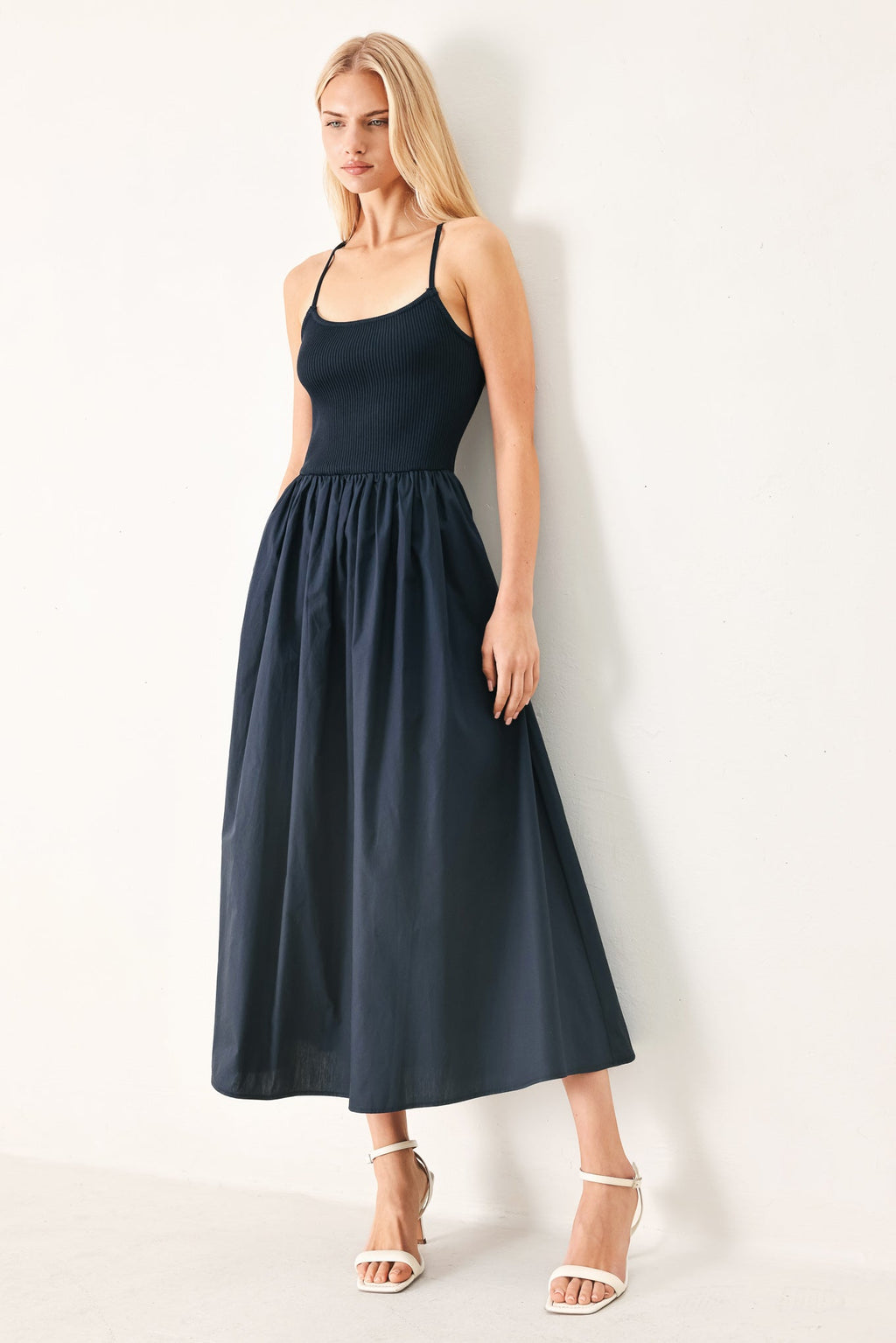Easy Breeze Navy Woven Midi Dress with ribbed sweater knit tank top, solid woven skirt, bare back, and lace-up tie detail shown on model