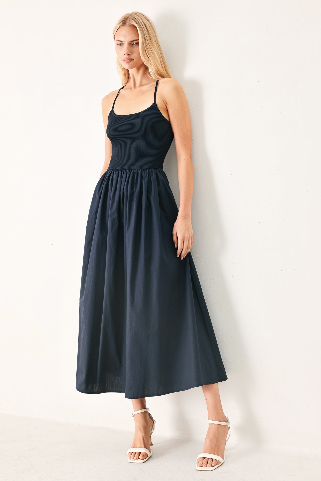 Easy Breeze Navy Woven Midi Dress with ribbed sweater knit tank top, solid woven skirt, bare back, and lace-up tie detail shown on model