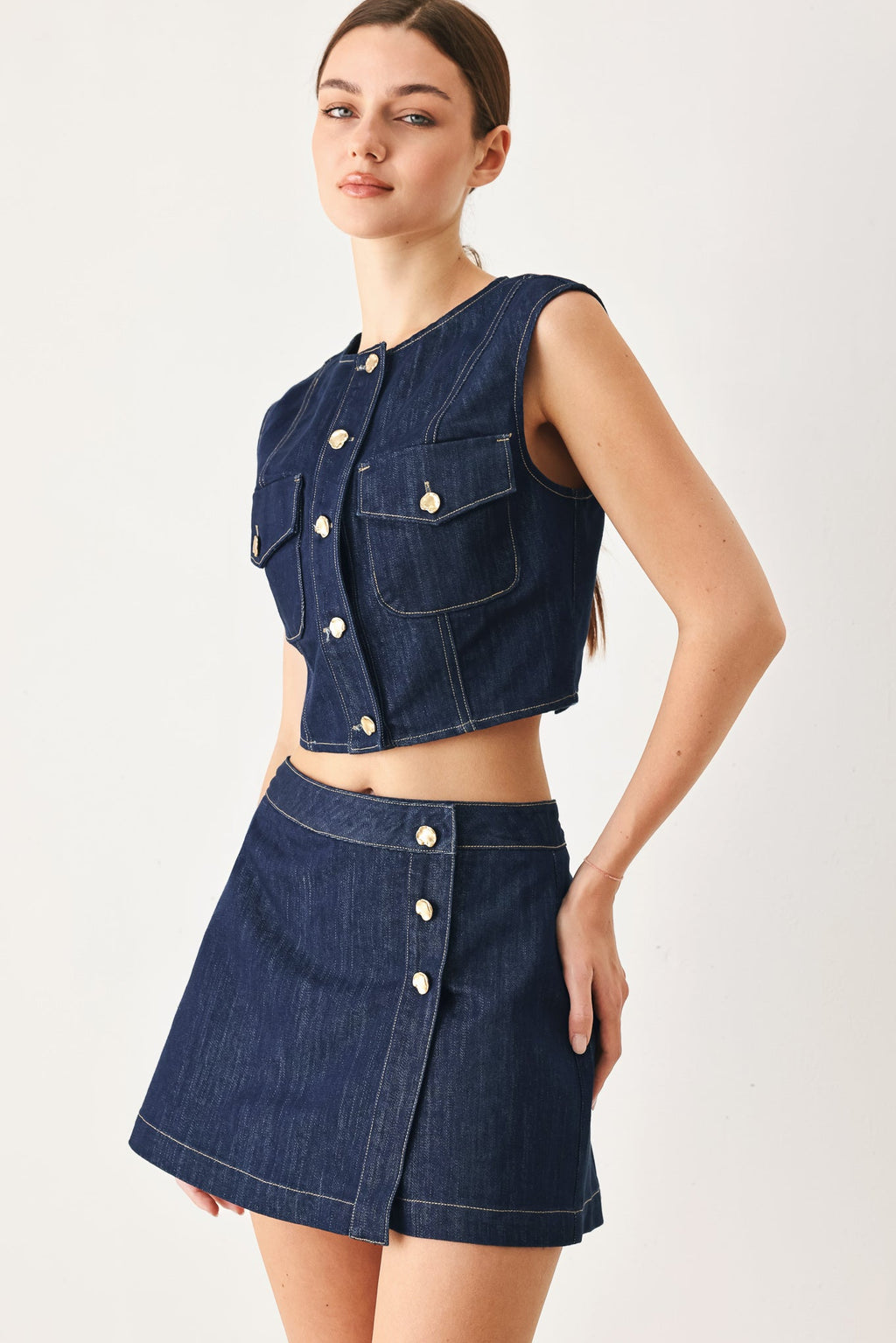 Indigo denim crop vest, tailored silhouette, 70% cotton 30% polyester