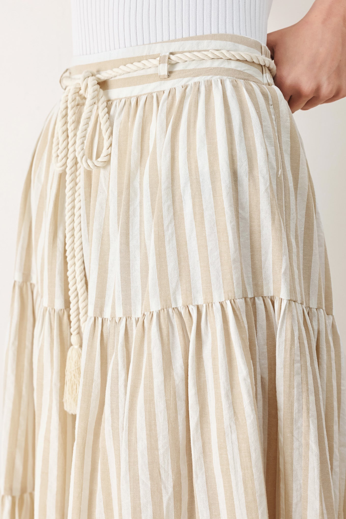 Hamptons Weekend Woven Maxi Skirt in Taupe White with stripe print, tiered layers, rope belt, and elastic back waistband shown on model