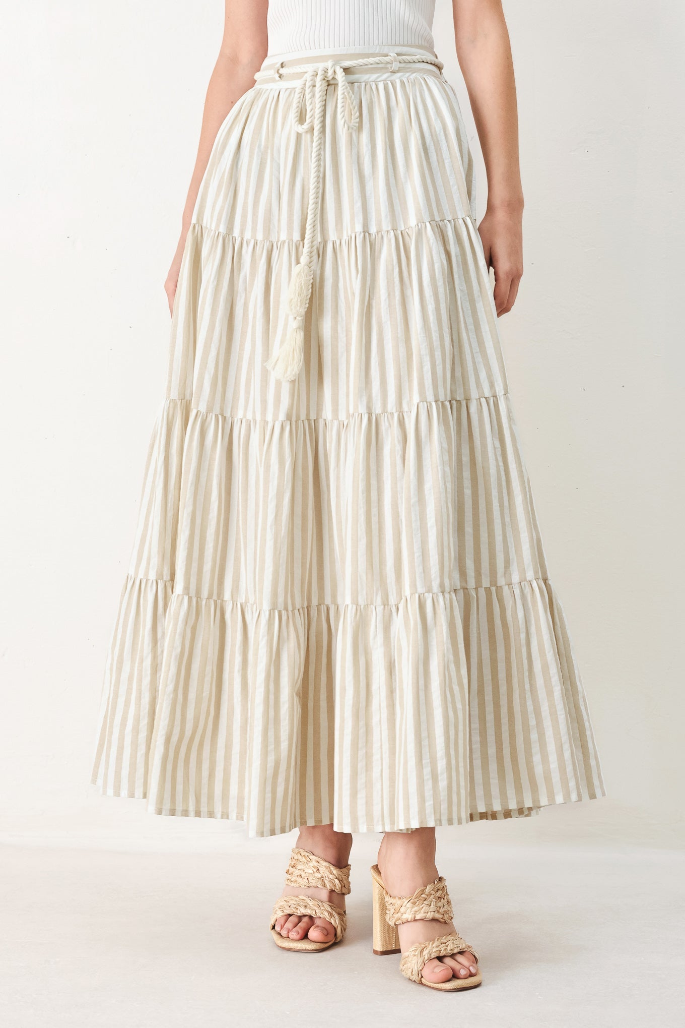 Hamptons Weekend Woven Maxi Skirt in Taupe White with stripe print, tiered layers, rope belt, and elastic back waistband shown on model