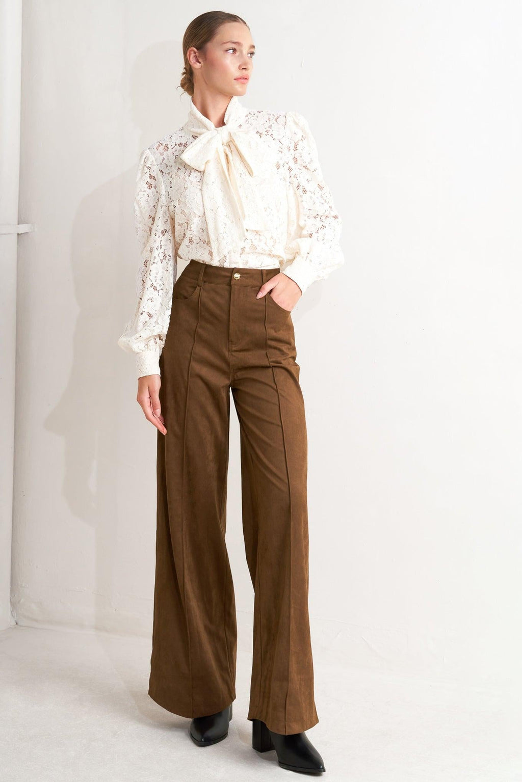 Faux Suede Flare Pants in maroon and brown, close-up detail