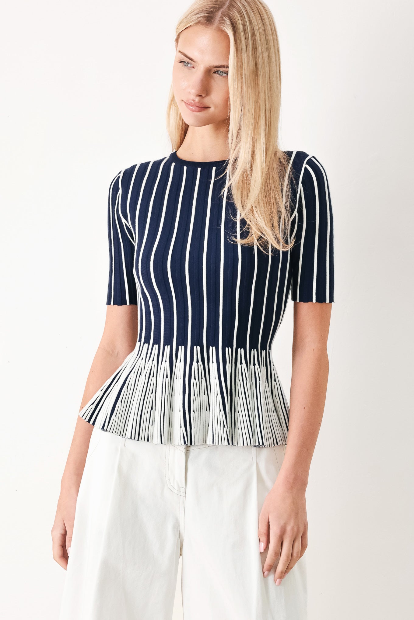 Easy Summer Stripe Sweater Knit Top in Navy White with round neckline, short sleeves, and peplum hem shown on model