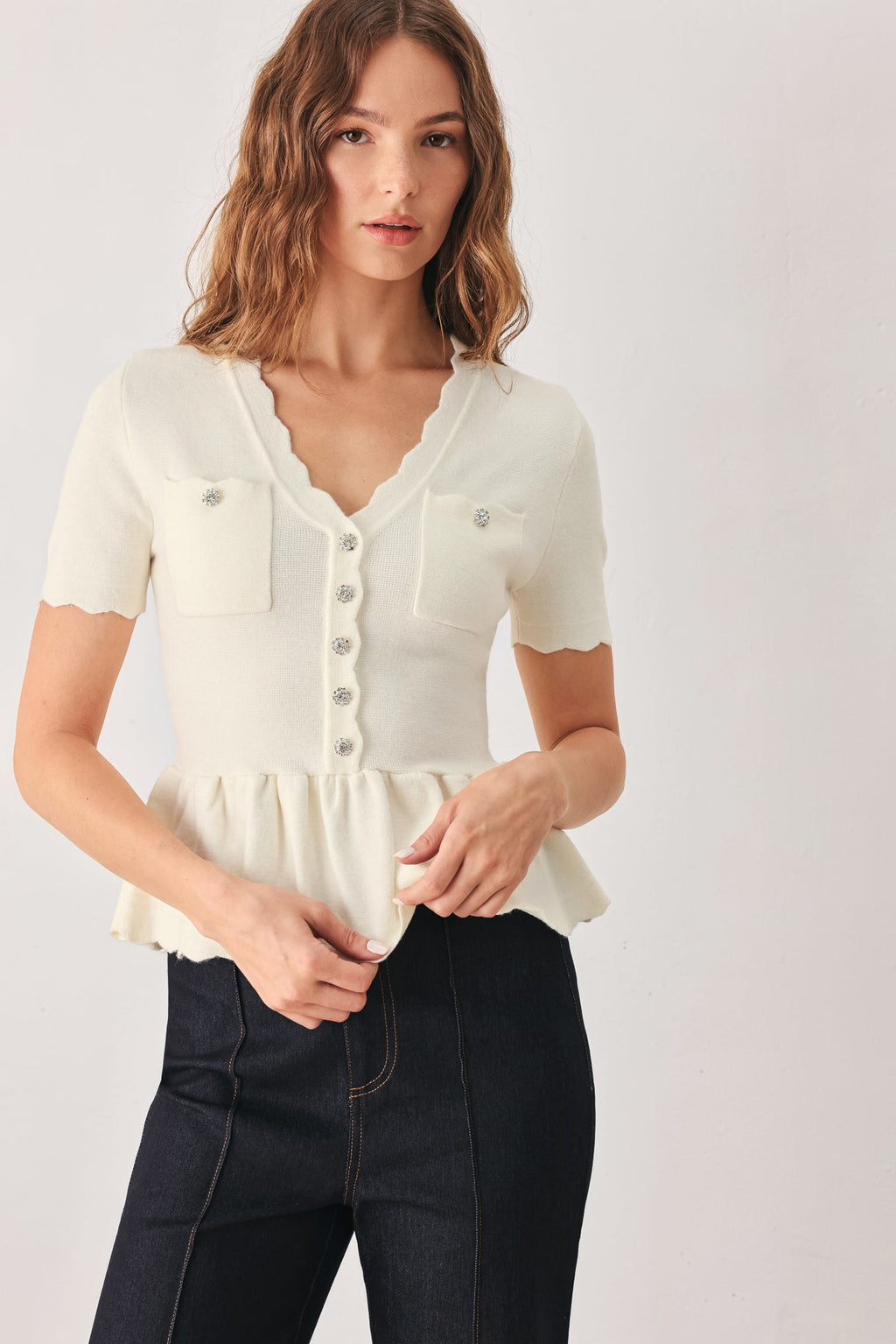 Scalloped V-Neck Peplum Sweater Top in off white, side view