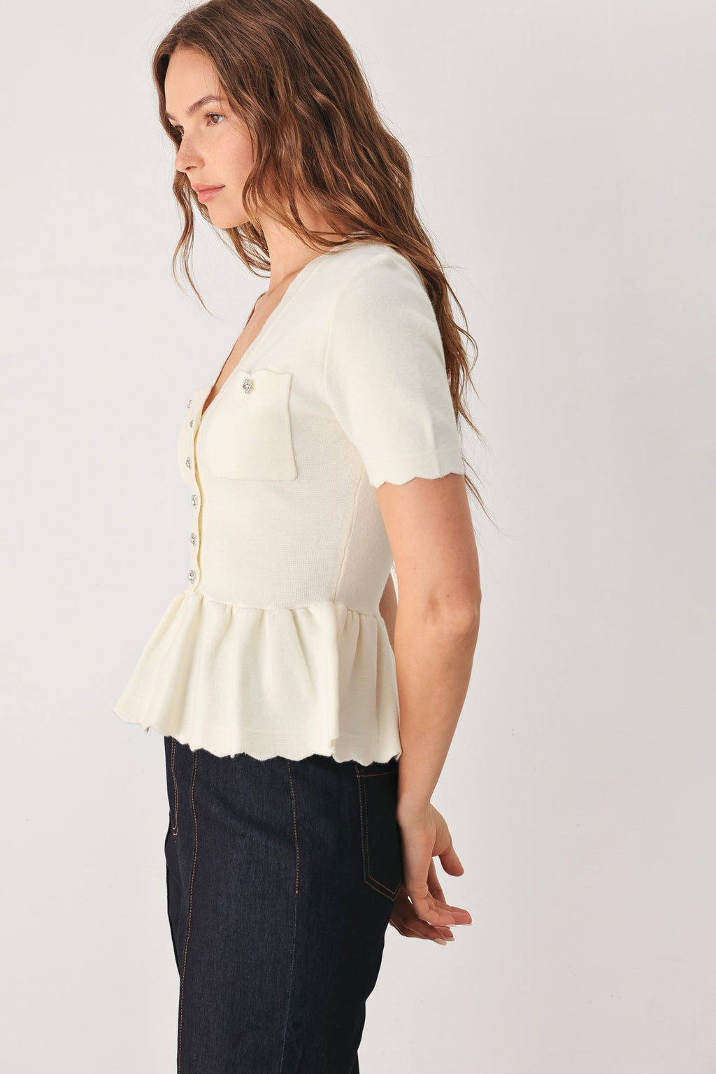 Scalloped V-Neck Peplum Sweater Top in off white, back view