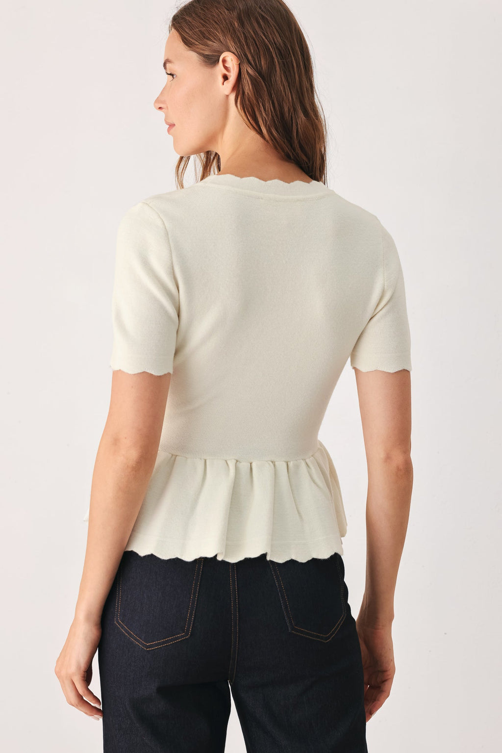 Scalloped V-Neck Peplum Sweater Top in off white, worn