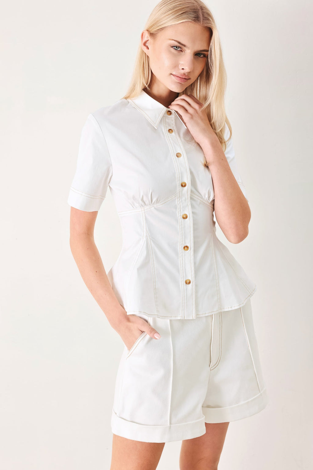 Made for Sunshine Woven Top in Off White with front button closure, short sleeves, and peplum hem shown on model