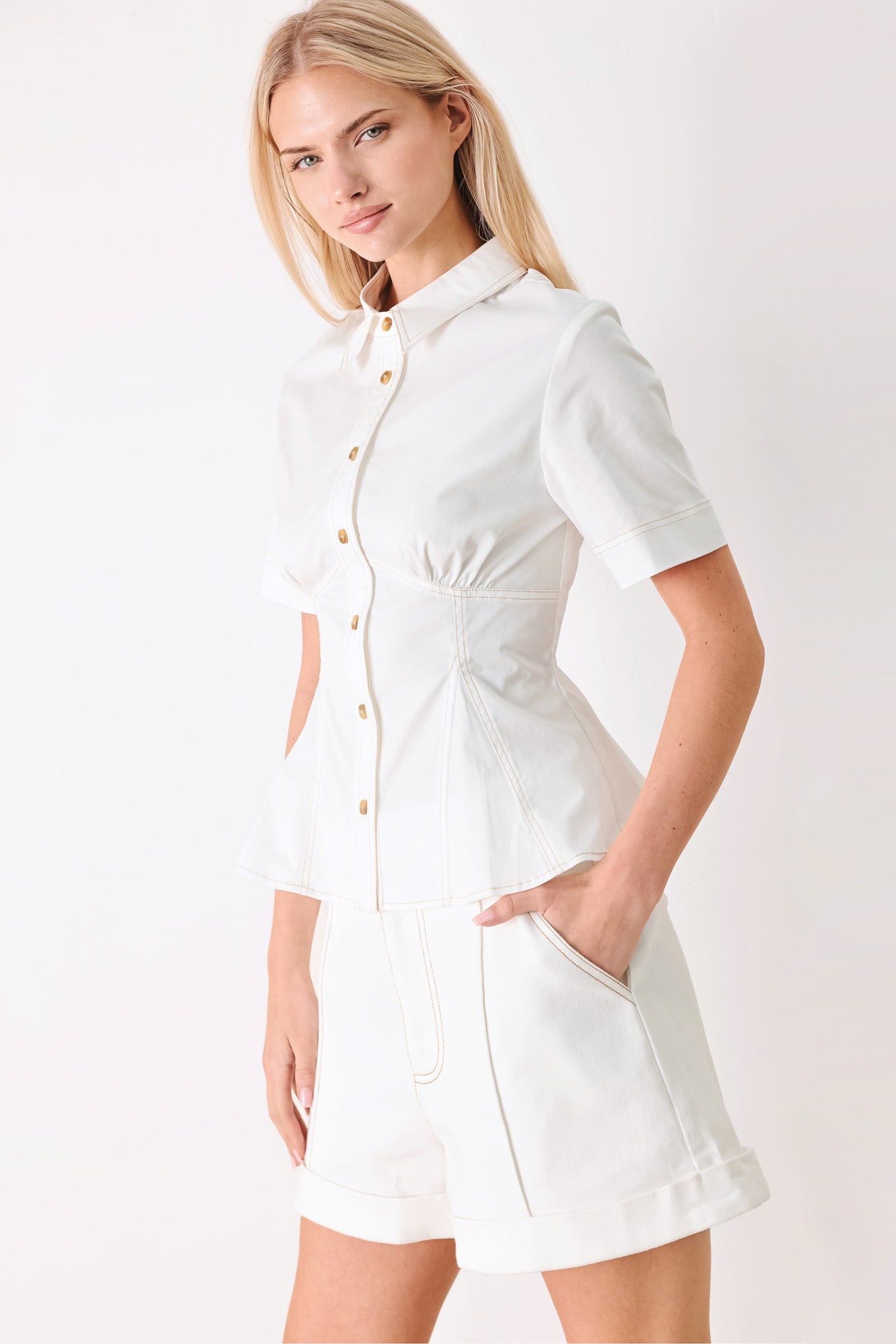 Made for Sunshine Woven Top in Off White with front button closure, short sleeves, and peplum hem shown on model