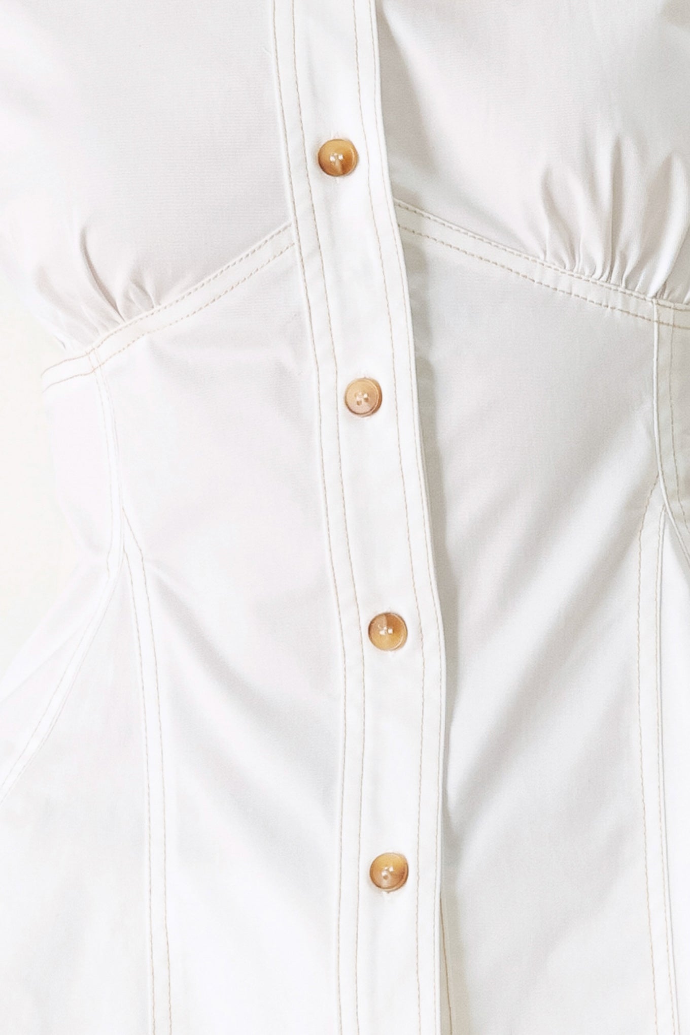 Made for Sunshine Woven Top in Off White with front button closure, short sleeves, and peplum hem shown on model