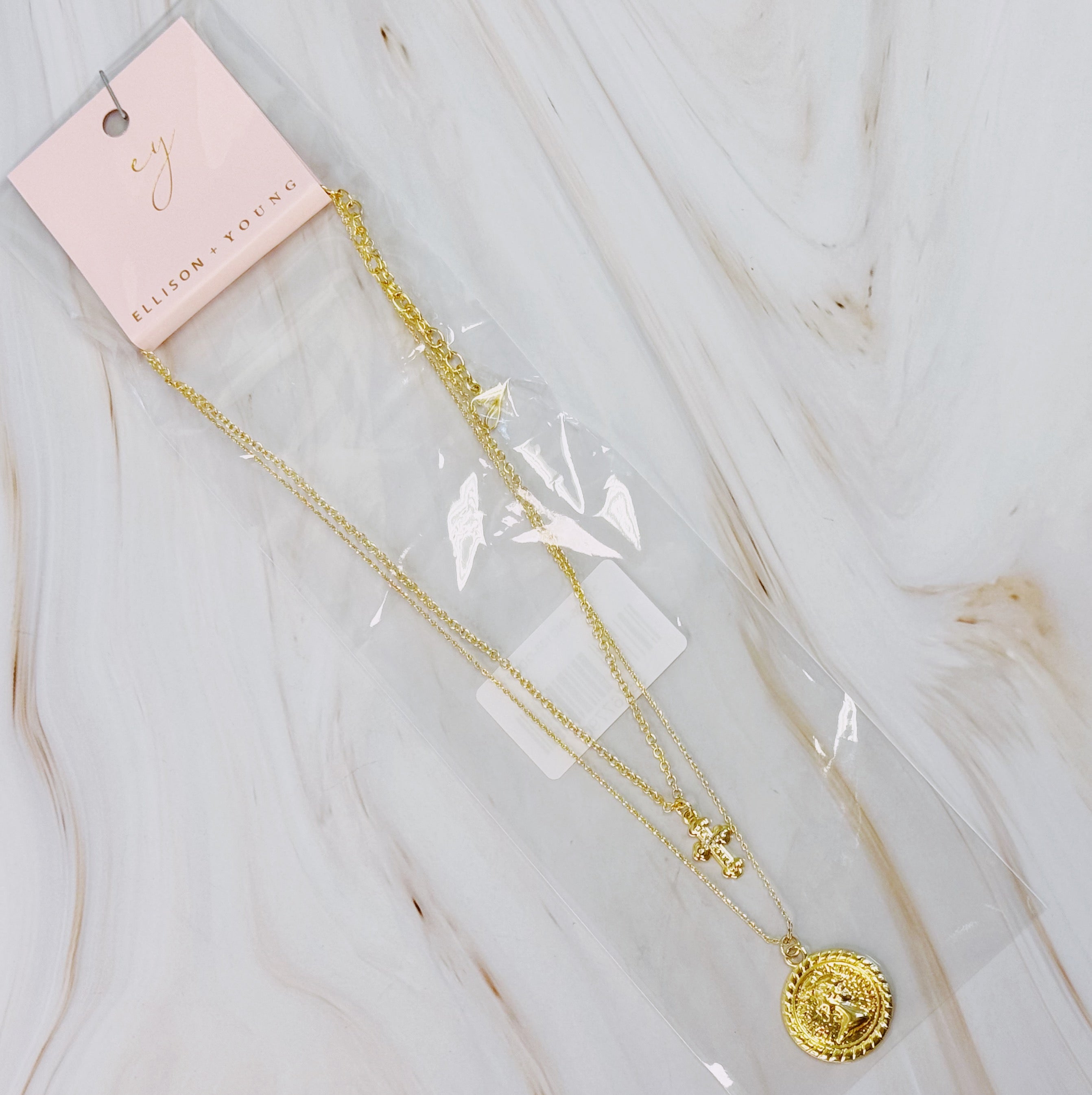 Cross And Coin Layered Necklace - flat lay view