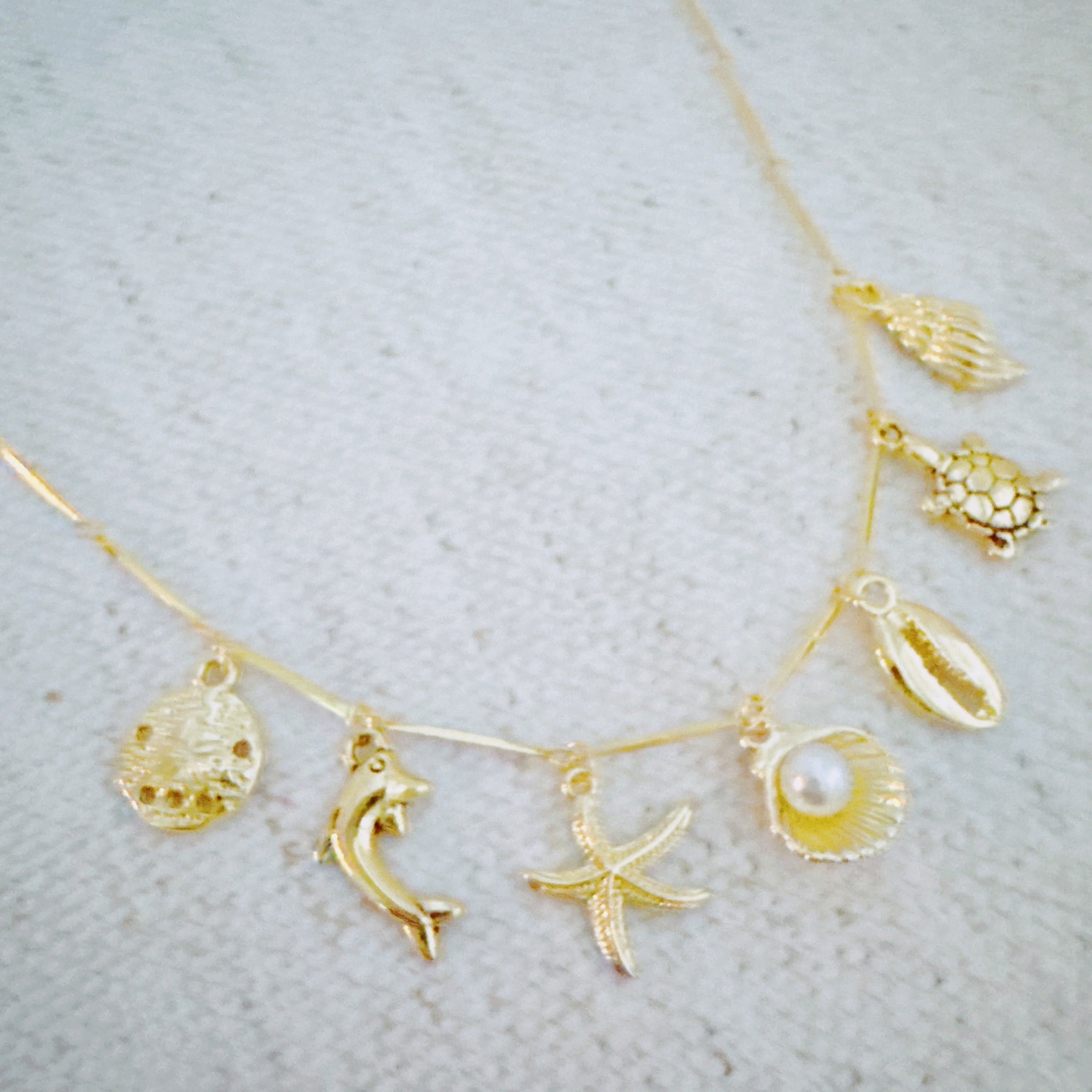 Golden Sea Charm Necklace - styled on model