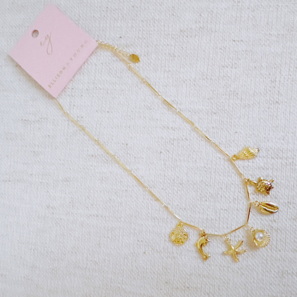 Golden Sea Charm Necklace - flat lay detail