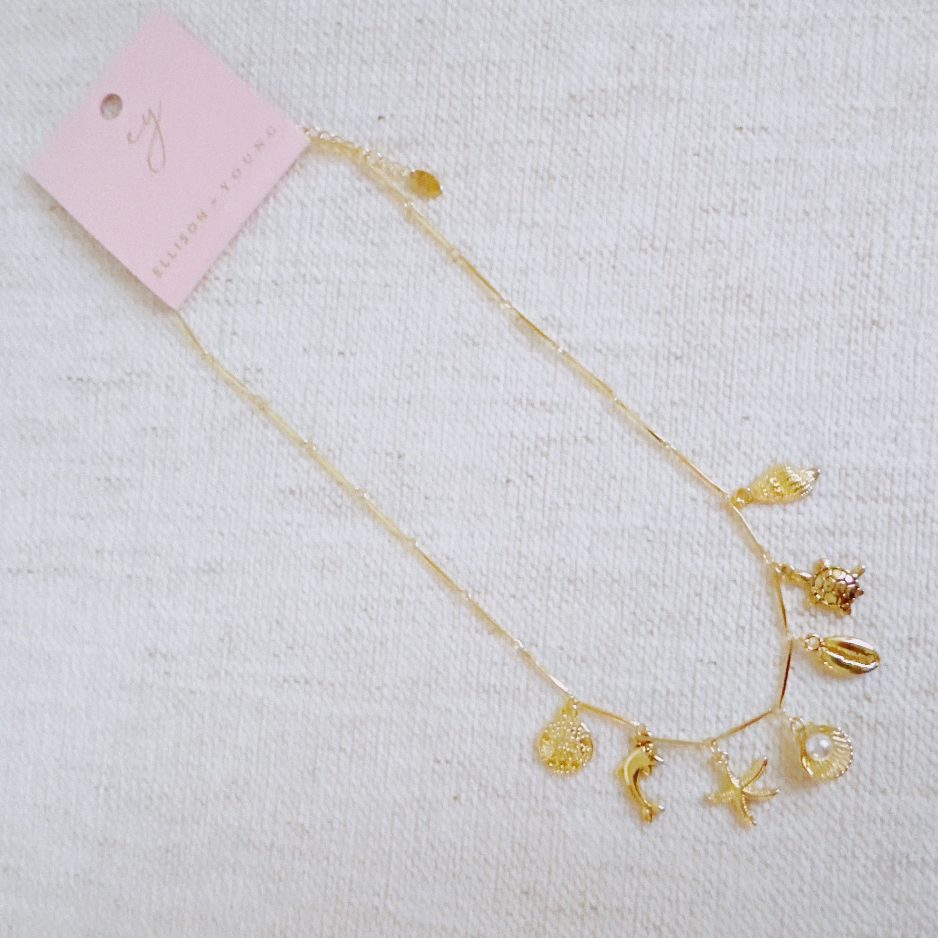 Golden Sea Charm Necklace - flat lay detail